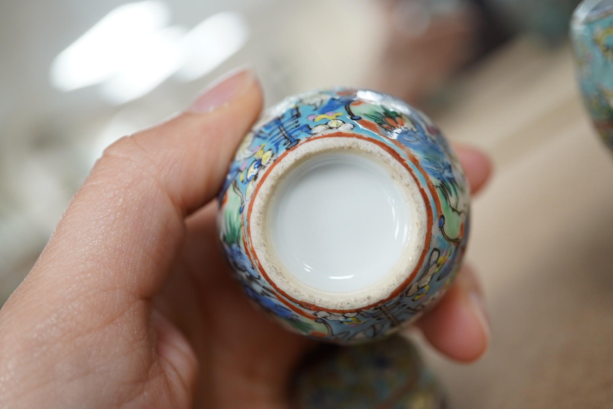 A complete Chinese porcelain nest of five enamelled porcelain barrel shaped boxes, c.1900, largest 12cm high. Condition - fair, some minor chipping